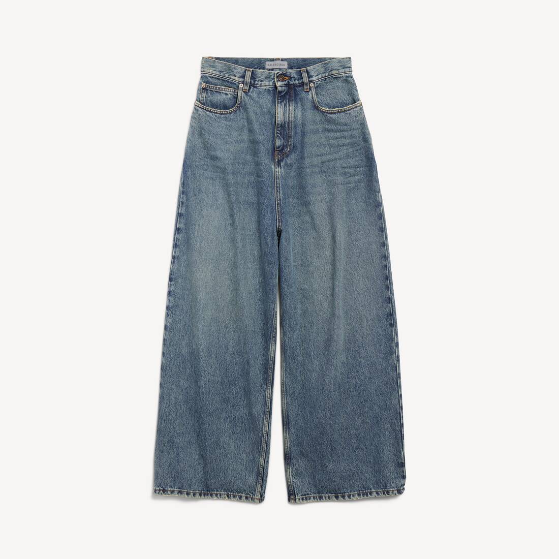 Damers låg crotch släppande jeans i smutsigt vintageblått