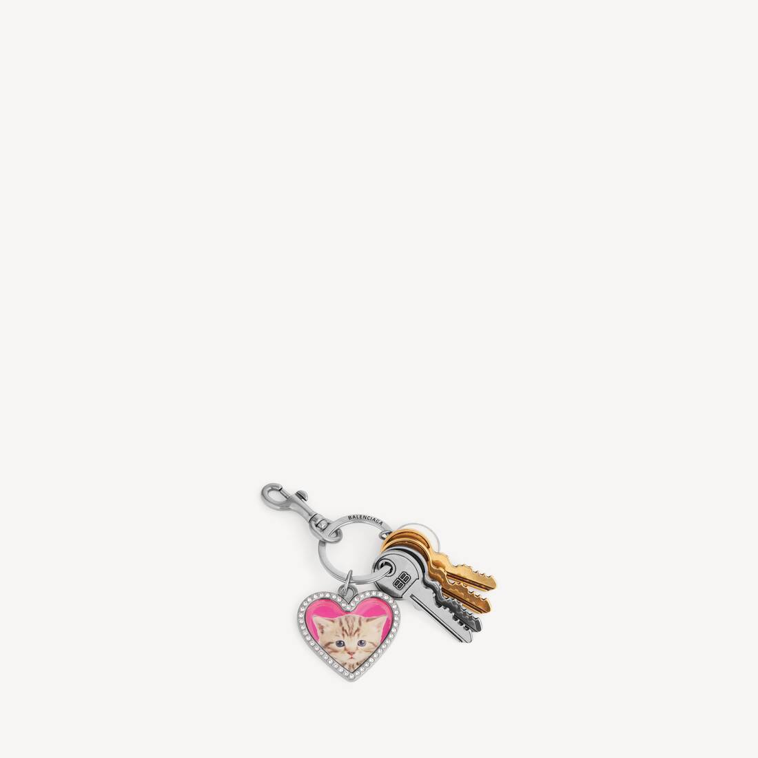 Kvinnas charm/nötklocka hjärta i fläckigt